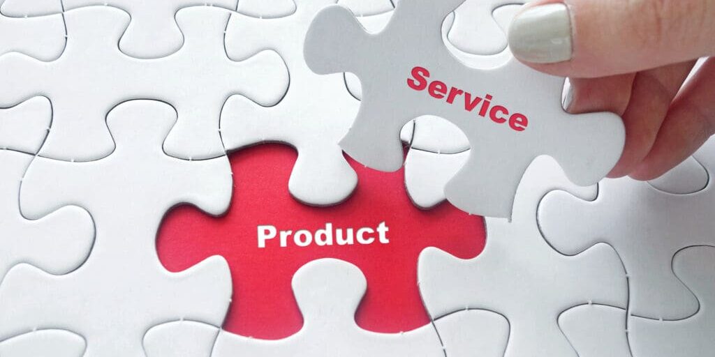 Close up of girl's hand placing the last jigsaw puzzle piece with word Product and Service as business concept